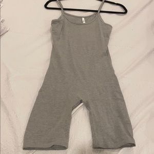 A gray tight body suit